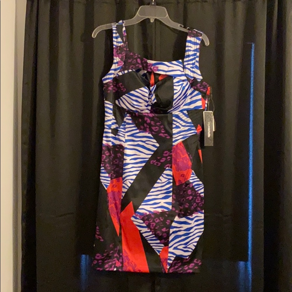 Party dress. Form fitting. Above the knee.